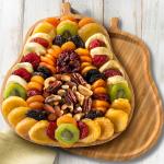 Festive Dried Fruit and Nuts on Bamboo Pear Shaped Cutting Board