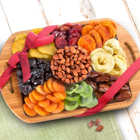 Dried Fruit Assortment with Almonds on Bamboo Cutting